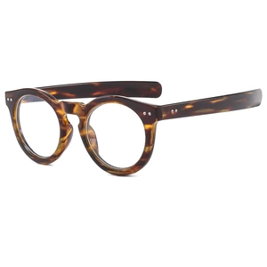 Classic round amber tortoise shell eyeglasses with retro frame and metal rivet details