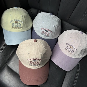 Detail of multi-color baseball caps with Evil Rabbits embroidery and premium cotton fabric