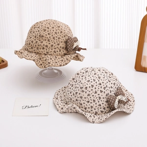 Floral print baby sun hat with polka dot bow and lace detail for infants and toddlers