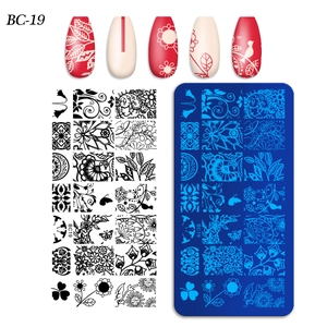 Macro detail of BC-19 rectangular nail stamping plate with intricate floral and bird patterns