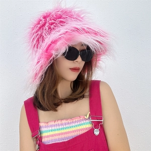 Close-up of pink faux Mongolian sheep fur bucket hat showing long plush texture