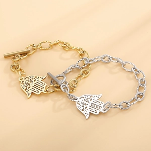 Hamsa hand charm chain bracelet in gold and silver finish with toggle clasp closure
