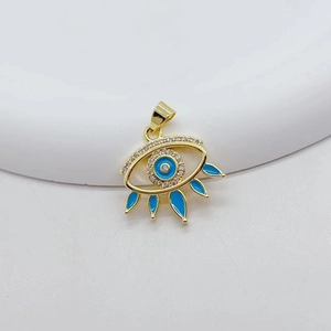 Detailed close-up of golden evil eye pendant with turquoise enamel and zircon stones