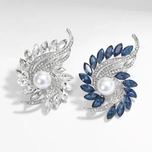 Elegant rotating flower brooch with a large white pearl and marquise-cut crystals