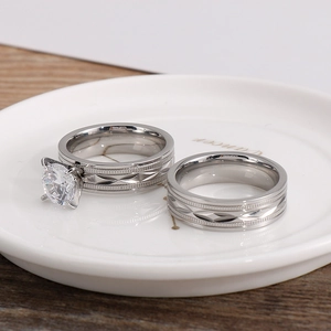 Detailed macro view of silver titanium steel rings with cubic zirconia and diamond patterns