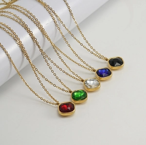 Detailed shot of multi-colored square zircon pendants on gold stainless steel chains