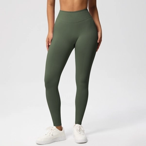 Macro detail of high-waisted olive green yoga leggings with ribbed knit fabric texture