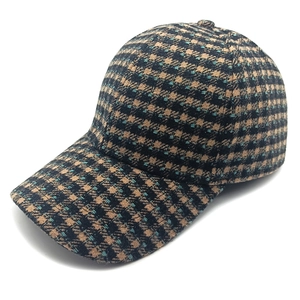 Women's plaid tweed baseball cap featuring retro black and blue wool texture