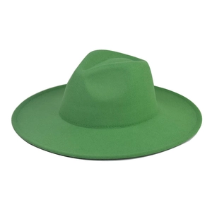 Close-up of bright green wool felt fedora hat showing textured wide brim and crown