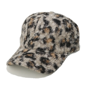 Detail of plush leopard print faux lamb wool baseball cap with thick fuzzy texture