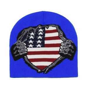 Detail of royal blue knit beanie with a torn American flag pattern and street style texture