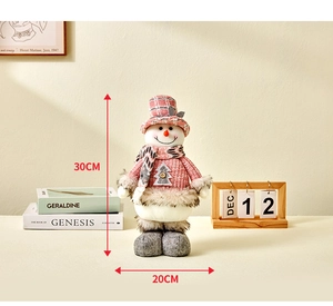 Pink snowman ornament made of knit fabric and faux fur standing 30cm tall as home decor