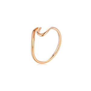 Detailed view of wave-shaped rose gold titanium steel ring on a white background