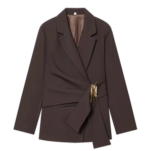 Detail of dark brown blazer featuring draped waist design and a gold metal buckle accent