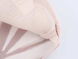 Detailed close-up of the breathable chiffon fabric texture and neat edge stitching finish