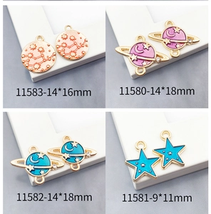 Detail view of colorful space enamel charms with model sizes for DIY jewelry crafts