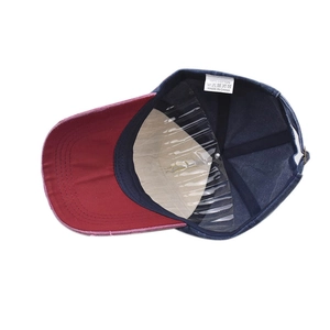 Detail view of cotton washing label and adjustable strap on a vintage baseball cap