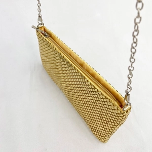 Golden sequin evening clutch bag with metal chain strap and yellow fabric lining