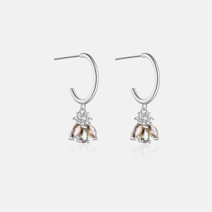 Detailed macro view of S925 sterling silver bee earrings with colorful zircon stones