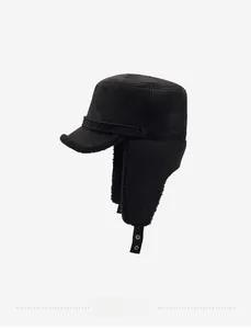 Detail view of black winter aviator hat with soft plush lining and snap ear flaps