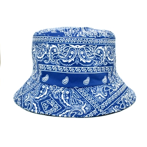Detailed close-up of navy paisley print on a reversible cotton canvas bucket hat