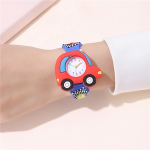 Detail of red car-shaped kids sports watch with blue racing flag strap on a wrist