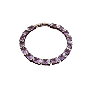 Elegant tennis bracelet with purple rectangular zircons and rose gold mechanical clasp