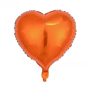 Detail of 18-inch heart-shaped metallic orange foil balloon for festive decoration