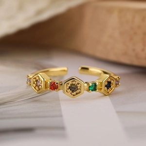 Golden geometric honeycomb ring with multi-color zircons in a minimalist open design