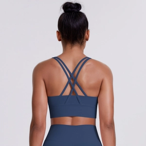Detail of the cross-strap back design on this seamless blue yoga sports bra