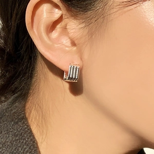 Minimalist square 925 sterling silver hoop earrings with vertical striped texture on model