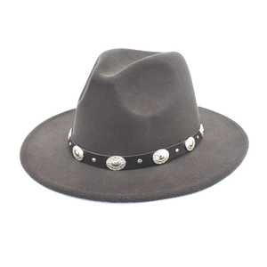 Close-up of wool fedora hat featuring a leather band with engraved silver metal studs