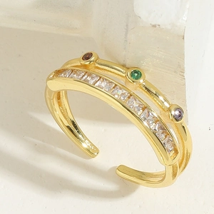 Detailed view of a gold double-layer open ring featuring zircon and colorful gemstones