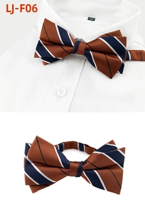 Detail view of blue and orange striped bowtie showing back structure and shirt placement