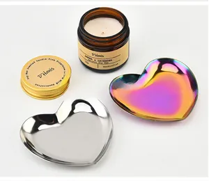 Close-up of heart-shaped stainless steel jewelry trays in silver and rainbow finishes