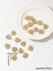 Detailed view of 20 pieces heart shaped gold charms with sparkling crystals for DIY jewelry