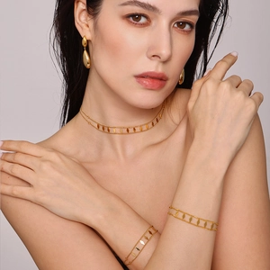 Golden stainless steel jewelry set with rhombus sequins worn by model for elegant style