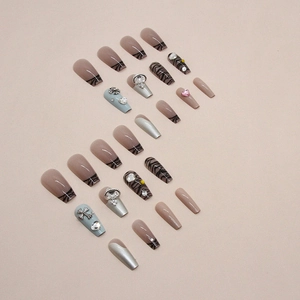 Silver leopard French press-on nails with shiny rhinestones and Y2K aesthetic decor