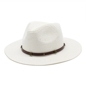 Detail of cream straw hat with brown leather band and vintage metal buckle rivets