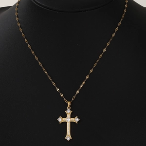 Golden cross necklace with micro-pave cubic zirconia crystals on a black neck bust