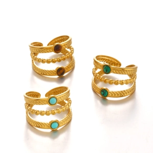 Trois bagues en acier doré serties de pierres naturelles turquoise, malachite et œil de tigre