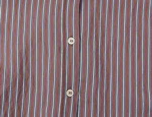 Macro view of striped poplin shirt fabric with vertical brown blue and white lines