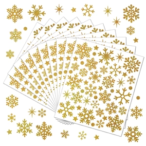 Detailed view of glittering gold snowflake stickers for holiday party gift decoration