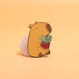 Cute Capybara enamel pin holding a small succulent pot, creative animal metal brooch