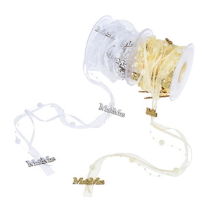Detail of white and champagne ribbons with pearls and Mr & Mrs metal pendants