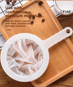 Close-up of fine nylon mesh kitchen strainer with white handle for soy milk and juice