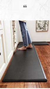 Detail of black non-slip PU leather kitchen mats with anti-fatigue foam and diamond texture
