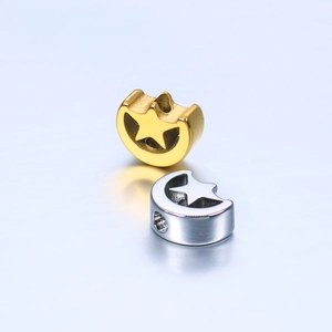 Detail of gold and silver crescent moon beads with star cutouts for DIY jewelry making