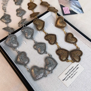 Vintage metal waist chain with heart-shaped floral carvings in gold and silver finish