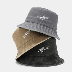 Washed cotton bucket hats in dark grey, khaki and black with white gesture embroidery
